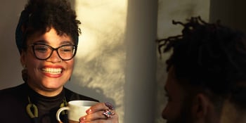 smiling lady drinking coffee